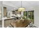 Bright kitchen and dining area with stainless steel appliances and sliding door access to deck at 434 Robin Rd, Chapel Hill, NC 27516