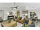 Open-concept living room with modern furnishings flowing into the dining and kitchen areas at 434 Robin Rd, Chapel Hill, NC 27516