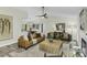 Spacious living room featuring a fireplace, ceiling fan and modern decor at 434 Robin Rd, Chapel Hill, NC 27516