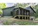 Exterior of house with a screened-in porch and wooden supports at 434 Robin Rd, Chapel Hill, NC 27516