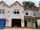 New construction townhome exterior with a garage and covered entrance, ready to be customized at 45 Calluna Dr, Clayton, NC 27520