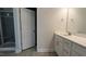 Modern bathroom featuring a glass enclosed shower, vanity with countertop, and tiled flooring at 457 Sweet Potato Lane # 13, Nashville, NC 27856