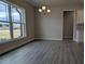 Bright breakfast area featuring large windows, modern chandelier, and easy access to kitchen and main living area at 457 Sweet Potato Lane # 13, Nashville, NC 27856