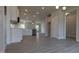 Modern kitchen featuring white cabinets, stainless steel appliances, and an open layout connected to a bright living area at 457 Sweet Potato Lane # 13, Nashville, NC 27856