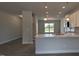 Open-concept living space with a kitchen island, modern lighting, and a seamless flow into adjacent living areas at 457 Sweet Potato Lane # 13, Nashville, NC 27856
