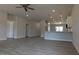 Bright, open living area with modern vinyl floors, pendant lighting over the kitchen island, and a view of entry ways at 457 Sweet Potato Lane # 13, Nashville, NC 27856