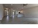 Spacious open-concept living area with modern vinyl floors, recessed lighting, and a kitchen featuring a peninsula at 457 Sweet Potato Lane # 13, Nashville, NC 27856