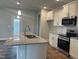 Bright kitchen featuring stainless steel appliances, granite countertops and modern lighting fixtures at 473 Sweet Potato Lane # 12, Nashville, NC 27856