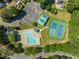 An aerial view of community amenities including a pool, tennis courts, and playground, showcasing the community's features at 4969 Royal Adelaide Way, Raleigh, NC 27604
