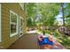 Back exterior view showcasing the deck, door and an outdoor play area at 4969 Royal Adelaide Way, Raleigh, NC 27604