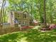 Back exterior of home featuring a wooden deck and spacious backyard area at 4969 Royal Adelaide Way, Raleigh, NC 27604