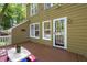 Back exterior view showcasing the deck and a door to the inside at 4969 Royal Adelaide Way, Raleigh, NC 27604