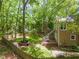 Aerial view of fenced backyard with mature trees and room for outdoor activities at 4969 Royal Adelaide Way, Raleigh, NC 27604