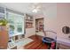 Bedroom with hardwood floors, closet, shelving, window seat, and plenty of natural light at 4969 Royal Adelaide Way, Raleigh, NC 27604