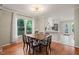 The dining room features a window view and is open to the updated kitchen with stainless appliances at 4969 Royal Adelaide Way, Raleigh, NC 27604