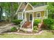 Home exterior with well-maintained landscaping and a welcoming brick-step entrance at 4969 Royal Adelaide Way, Raleigh, NC 27604