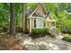 Charming front exterior view features mature landscaping and a cozy porch at 4969 Royal Adelaide Way, Raleigh, NC 27604