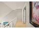 Upstairs hallway with carpet and a painting on the wall at 4969 Royal Adelaide Way, Raleigh, NC 27604