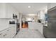 Updated kitchen open to the dining room and living room with stainless appliances at 4969 Royal Adelaide Way, Raleigh, NC 27604