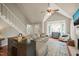Cozy living room featuring a fireplace, bay window, hardwood flooring, and staircase at 4969 Royal Adelaide Way, Raleigh, NC 27604