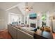 Inviting living room featuring hardwood floors, a fireplace, bay window, and plenty of light at 4969 Royal Adelaide Way, Raleigh, NC 27604