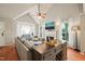 Bright living room featuring hardwood floors, a bay window, fireplace, and ample natural light at 4969 Royal Adelaide Way, Raleigh, NC 27604