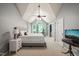 Spacious main bedroom with vaulted ceiling, windows and an ensuite office area at 4969 Royal Adelaide Way, Raleigh, NC 27604