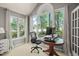 Bright office area with a desk setup and natural light through large windows at 4969 Royal Adelaide Way, Raleigh, NC 27604