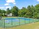 Well-maintained tennis courts available for residents within a lush green outdoor setting at 4969 Royal Adelaide Way, Raleigh, NC 27604