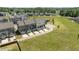 Aerial view of well-maintained townhome community with green spaces and parking areas at 520 Austin View Blvd, Wake Forest, NC 27587