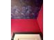 Close-up view of the stylish powder room's ceiling with dark floral wallpaper and contrasting pink walls at 520 Austin View Blvd, Wake Forest, NC 27587