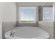 Bathroom showcases a luxurious soaking tub next to a glass-enclosed shower, promising relaxation and convenience at 520 Austin View Blvd, Wake Forest, NC 27587