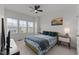 Bright bedroom with three large windows and a comfortable bed, creating a cozy and inviting atmosphere at 520 Austin View Blvd, Wake Forest, NC 27587