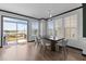 Bright dining room with modern table set, slider door to deck, and natural light at 520 Austin View Blvd, Wake Forest, NC 27587