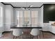 The dining room features stylish table and chairs, modern lighting fixture, and natural light from nearby windows at 520 Austin View Blvd, Wake Forest, NC 27587
