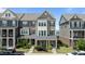 Charming townhome with landscaped front yard and covered porch, perfect for relaxing outdoors at 520 Austin View Blvd, Wake Forest, NC 27587