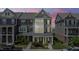 Charming townhome with landscaped front yard and covered porch, perfect for relaxing outdoors at 520 Austin View Blvd, Wake Forest, NC 27587