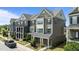 Well-maintained townhome showcases traditional design with landscaped front yards and a modern color scheme at 520 Austin View Blvd, Wake Forest, NC 27587