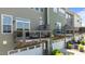 Exterior view of townhome featuring attached garage and rear decks overlooking green space at 520 Austin View Blvd, Wake Forest, NC 27587