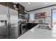 Close-up of modern kitchen with stainless steel appliances, quartz counters, and ample cabinet space at 520 Austin View Blvd, Wake Forest, NC 27587