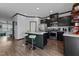 Spacious kitchen features stainless steel appliances, stylish island with seating, and ample counter space at 520 Austin View Blvd, Wake Forest, NC 27587