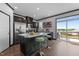Stylish kitchen boasts stainless steel appliances, quartz countertops, kitchen island and a sliding door to outdoor deck at 520 Austin View Blvd, Wake Forest, NC 27587