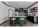 Beautiful kitchen features stainless appliances, quartz countertops, breakfast bar island with modern stools, and ample storage at 520 Austin View Blvd, Wake Forest, NC 27587