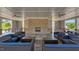 Pavilion interior showcasing a stone fireplace, contemporary seating, and a cozy ambiance at 520 Austin View Blvd, Wake Forest, NC 27587