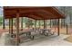 Community picnic shelter featuring several picnic tables and forested scenery at 520 Austin View Blvd, Wake Forest, NC 27587