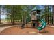 New playground equipment with shade covering, slide and climbing areas are surrounded by green trees at 520 Austin View Blvd, Wake Forest, NC 27587