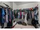 Organized walk-in closet with ample hanging space and storage solutions, maximizing space and convenience at 520 Austin View Blvd, Wake Forest, NC 27587