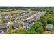 A neighborhood aerial view showcases landscaped yards, tree-lined streets, and a home with a backyard pool at 528 Brycewood Dr, Burlington, NC 27215