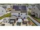 Backyard view featuring solar panels, a covered patio, and a well-maintained lawn at 528 Brycewood Dr, Burlington, NC 27215