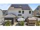 Backyard view featuring solar panels, a covered patio, and a well-maintained lawn at 528 Brycewood Dr, Burlington, NC 27215